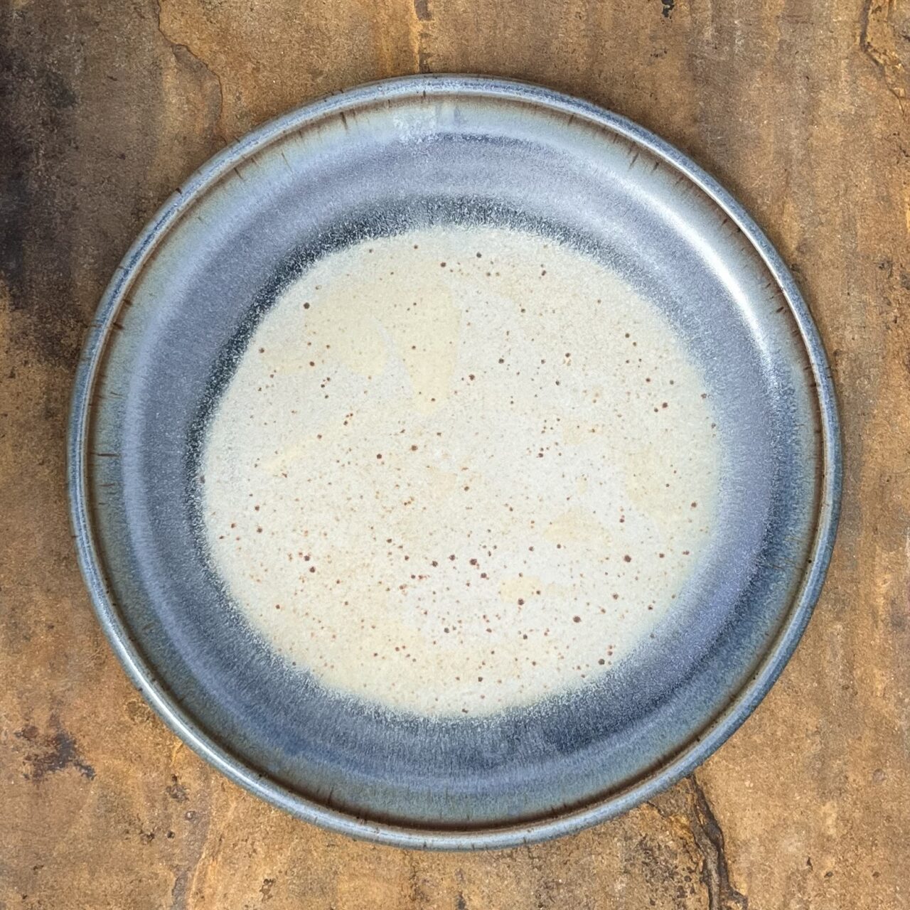 Julia Mann finished platter with blue texture and mamo glaze, birdseye view Julia Mann finished platter with blue texture and mamo glaze, birdseye view