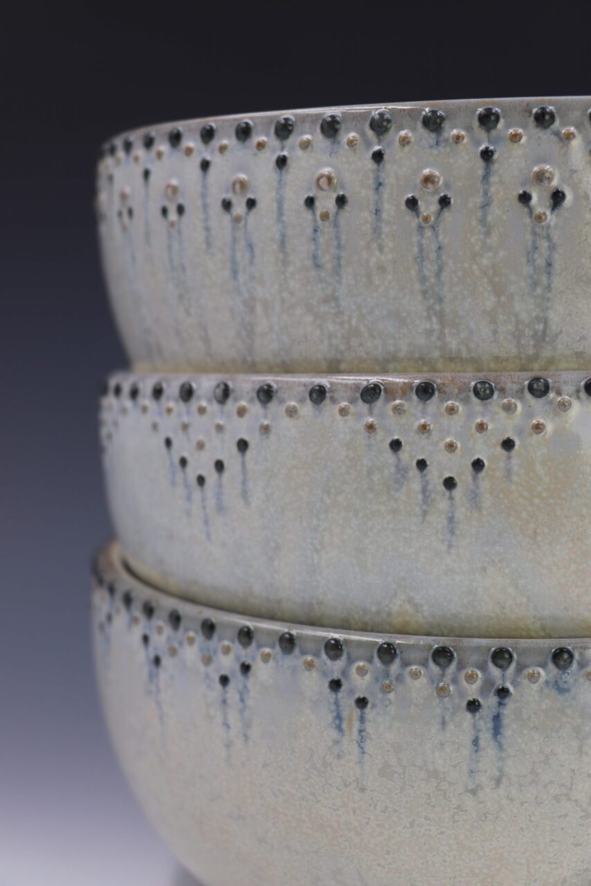 Close up of Katie Meili Messersmith finished pots, dotted serving bowls, dot pots, surface design Close up of Katie Meili Messersmith finished pots, dotted serving bowls, dot pots, surface design