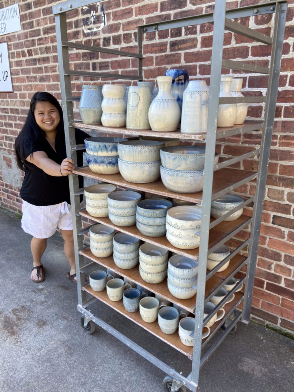 Katie Meili Messersmith with ware cart full of her finished pots, dot pots, abundance Katie Meili Messersmith with ware cart full of her finished pots, dot pots, abundance