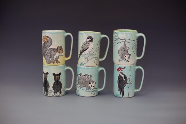 Maria Andrade Troya finished pots, mugs grouping, animal illustrations surface design