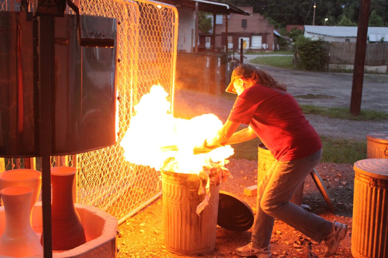 Judi Harwood active raku firing, fire in trash can Judi Harwood active raku firing, fire in trash can