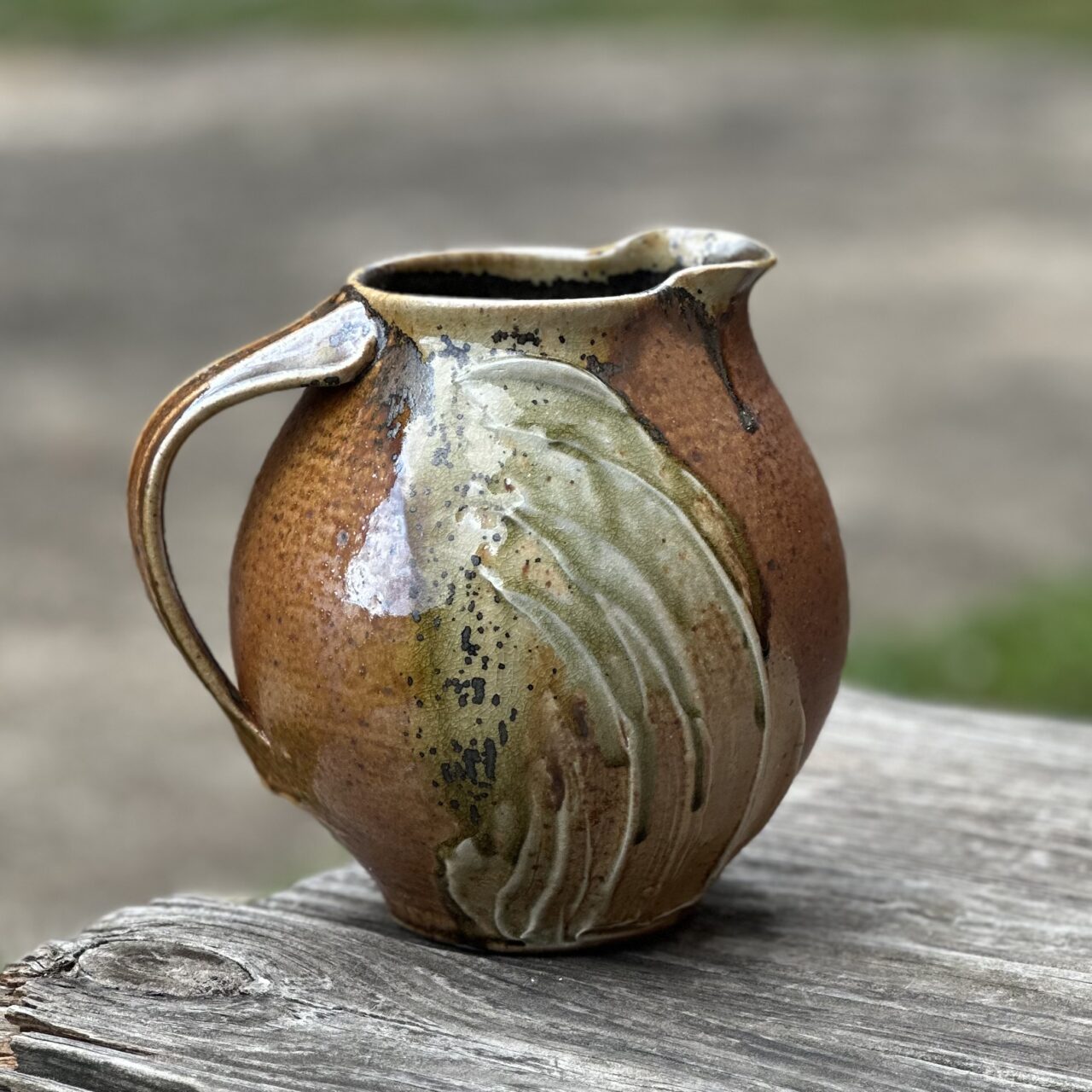 Sarah Wells Rolland finished pot, melon pitcher, wood soda kazie fired, seagrass slip Sarah Wells Rolland finished pot, melon pitcher, wood soda kazie fired, seagrass slip