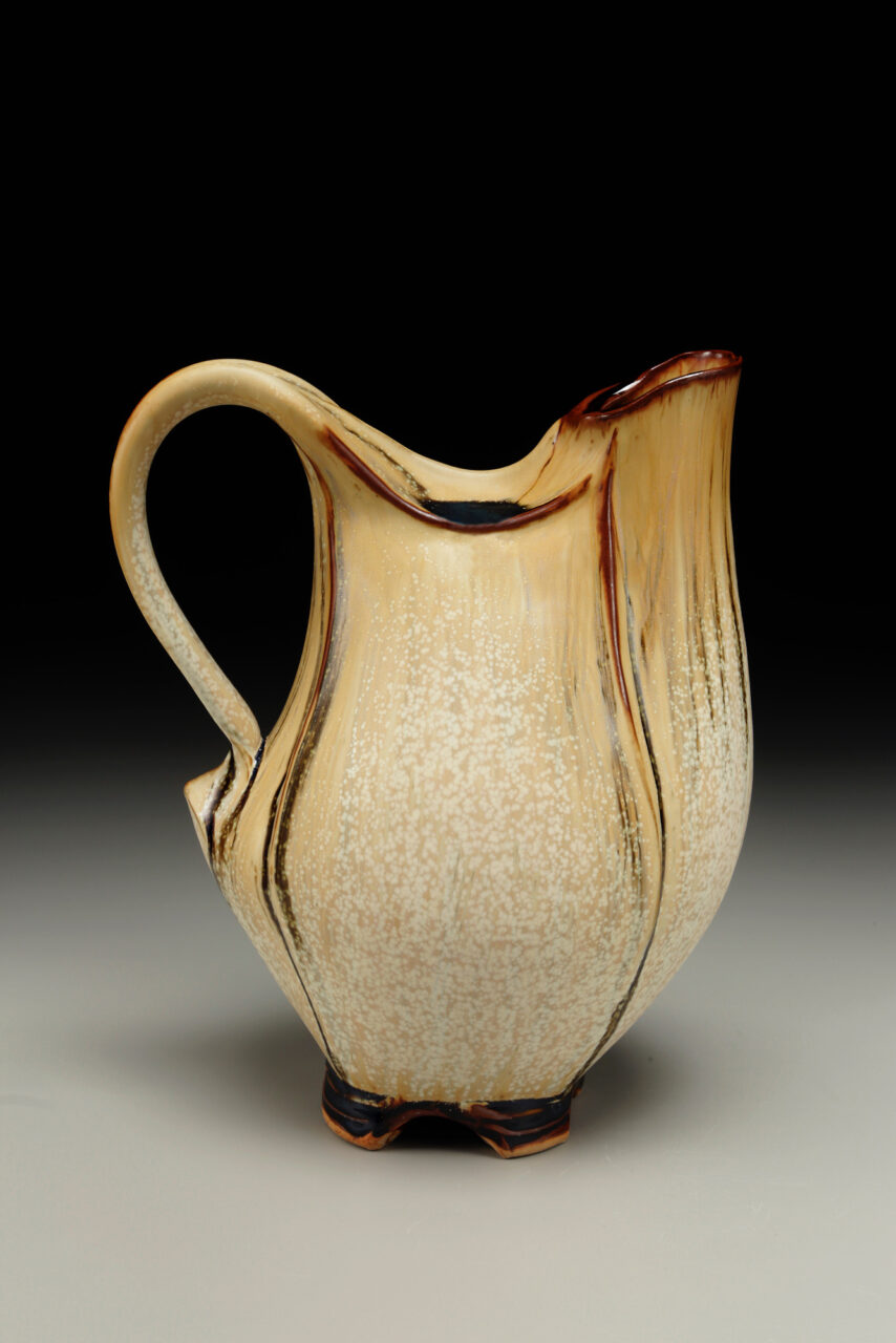 Sarah Wells Rolland Closed Form Pitcher glazed in pumpkin and leach black, finished pot Sarah Wells Rolland Closed Form Pitcher glazed in pumpkin and leach black, finished pot