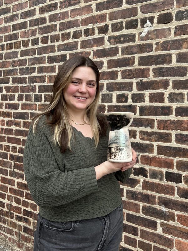 Kyra Pruitt with her raku finished pot