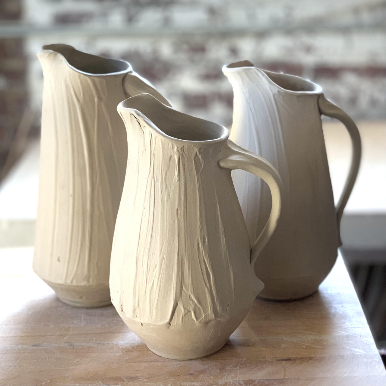 Sarah Wells Rolland leather hard pots, pitchers pouring vessels, slip surface Sarah Wells Rolland leather hard pots, pitchers pouring vessels, slip surface