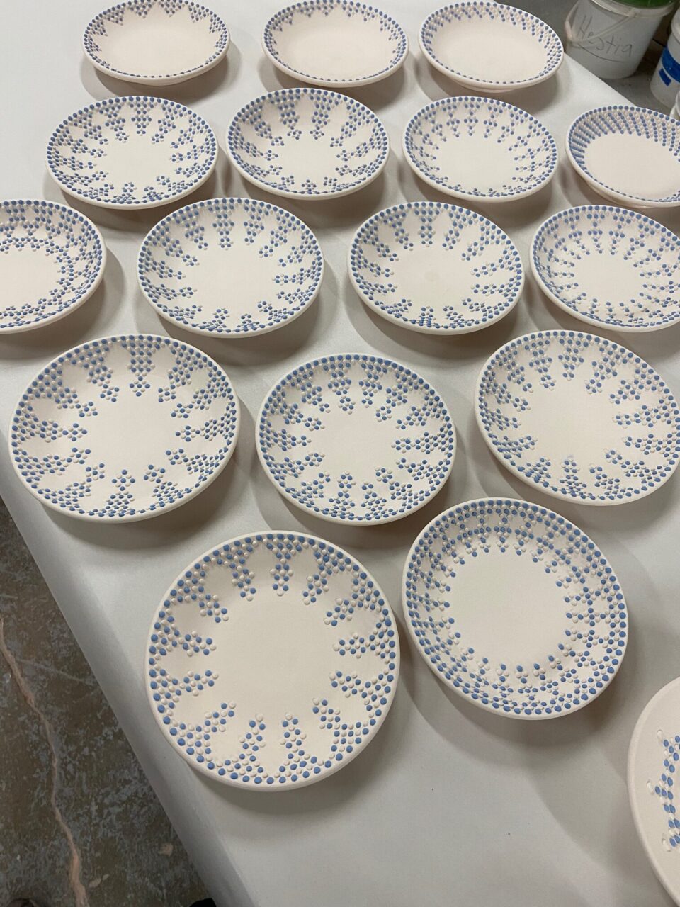 Katie Meili Messersmith dot pots, plates, slip trailing, surface design, abundance bisqueware, birdseye view, our stock image Katie Meili Messersmith dot pots, plates, slip trailing, surface design, abundance bisqueware, birdseye view, our stock image