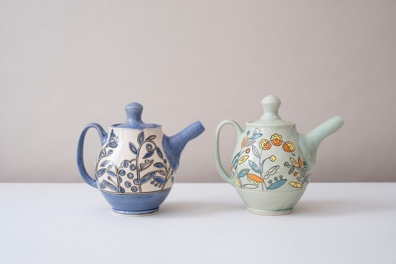 Maria Andrade Troya finished pots, teapot, colorful vines and blue vines, Photo by Nicole McConville (www.nicolemcconville.com) Maria Andrade Troya finished pots, teapot, colorful vines and blue vines, Photo by Nicole McConville (www.nicolemcconville.com)